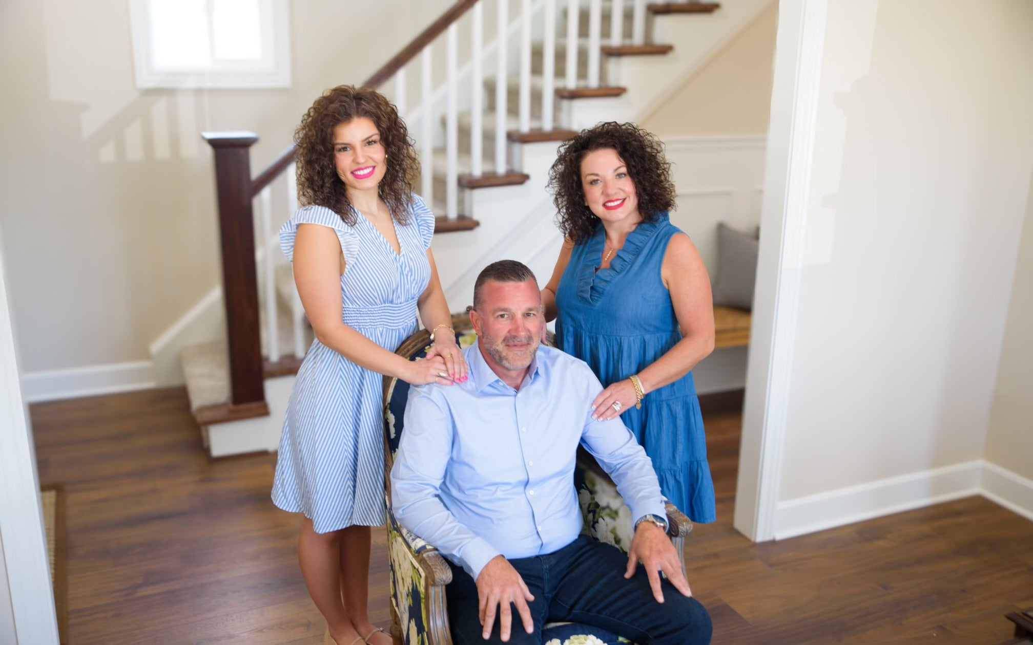 Jason, Tabitha & Lexi posing for a photo in a home interior setting.
